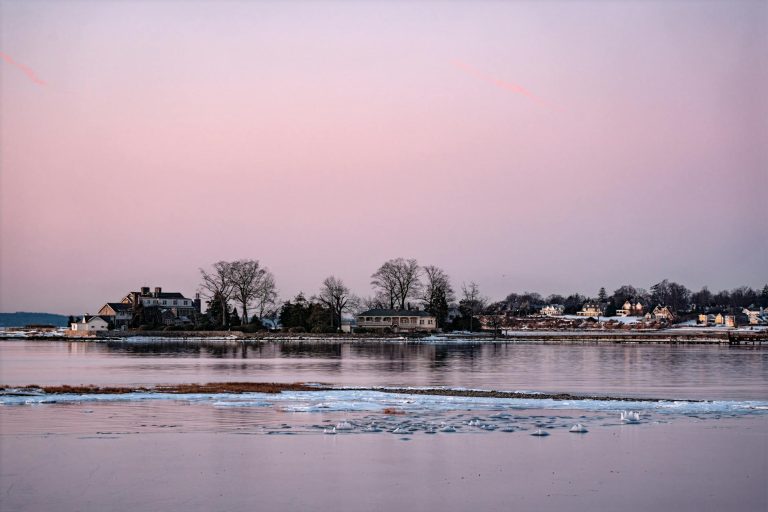 Beautiful winter sunrise over icy waters at Cove Island Park, Stamford, Connecticut.