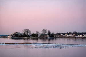 Beautiful winter sunrise over icy waters at Cove Island Park, Stamford, Connecticut.
