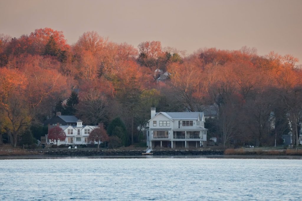 Stunning autumn foliage frames charming waterfront homes in Stamford, Connecticut.