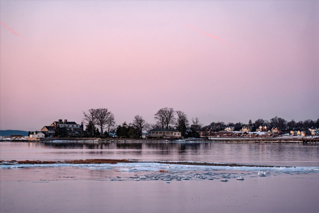 Beautiful winter sunrise over icy waters at Cove Island Park, Stamford, Connecticut.