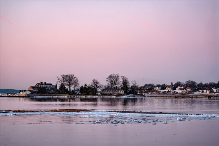 Beautiful winter sunrise over icy waters at Cove Island Park, Stamford, Connecticut.